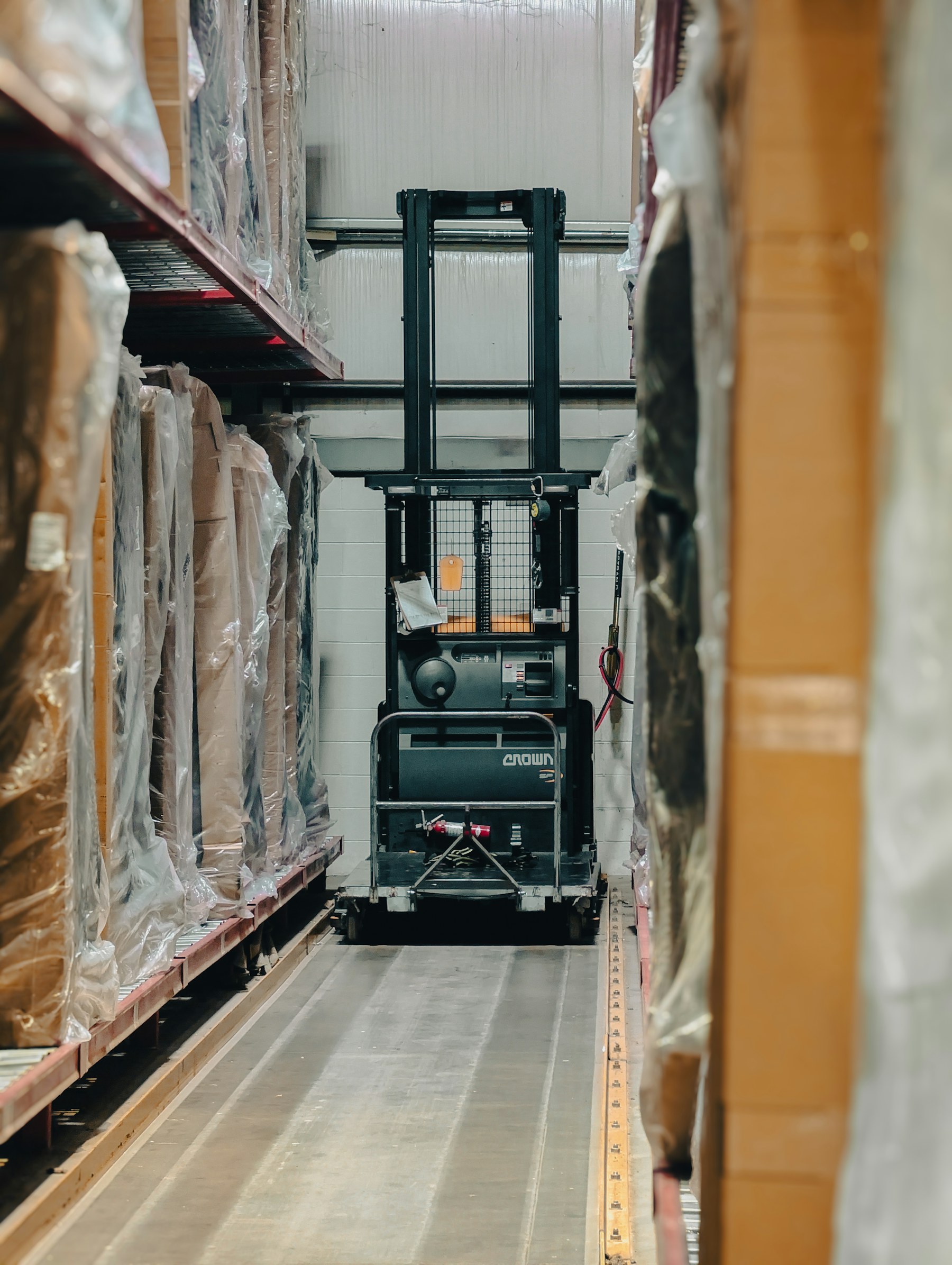 Forklift in a well-organized logistics warehouse